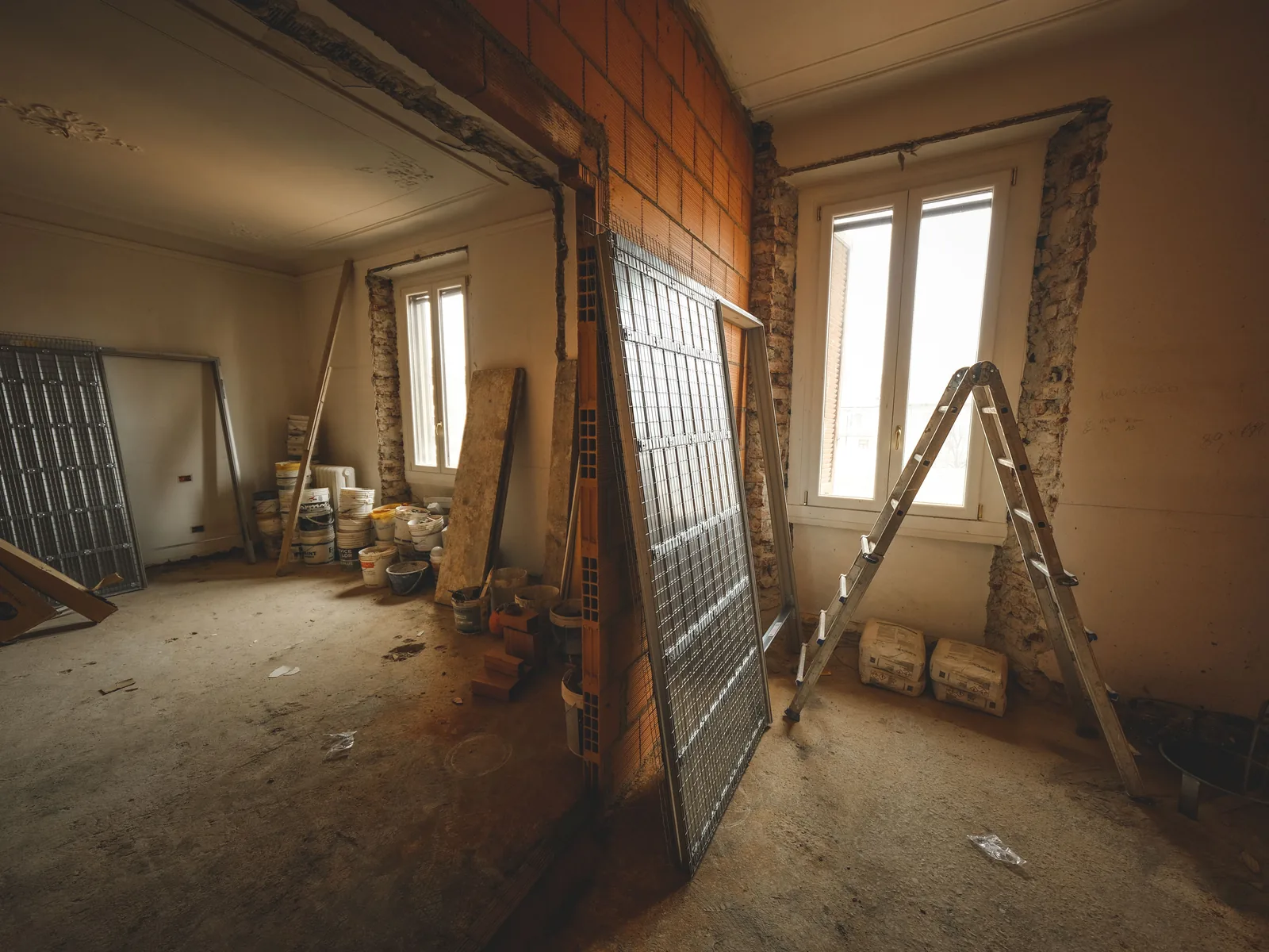 An older room stripped back before new board goes on